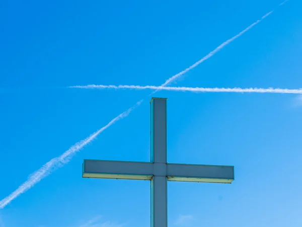 Religious cross and cross in the sky
