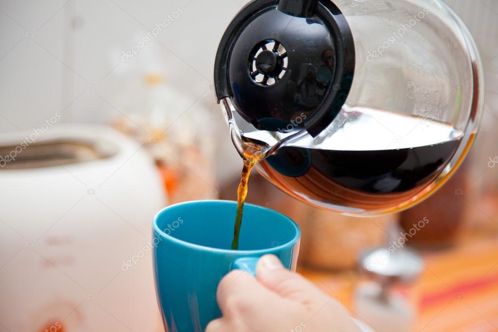 Woman Pouring Coffee Pot Into Coffe Mug Stock Photo Woman Pouring Coffee Pot Into Coffe Mug Stock Photo