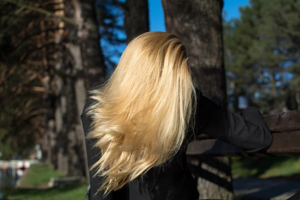 Beautiful Young sexy attractive girl with blond hair in a park — Stock Photo, Image