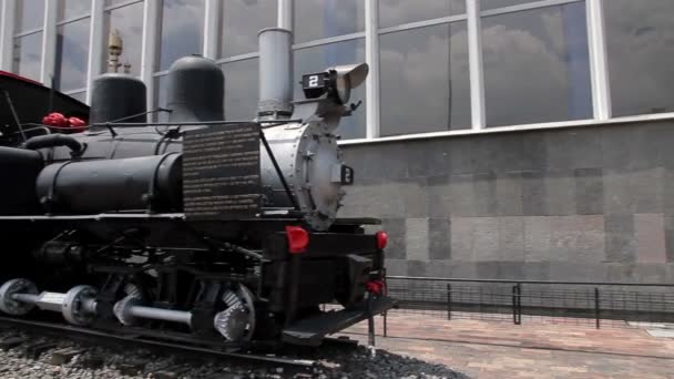 Mexico City, Mexico-August 2014: FULL SHOT. Old locomotive, outside Buenavista rail station. — Stock Video