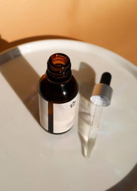 Brown bottle with natural cosmetics with pipette cap
