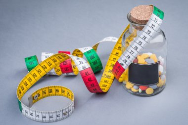 Diyet hapları teyp ölçme ile bir şişe