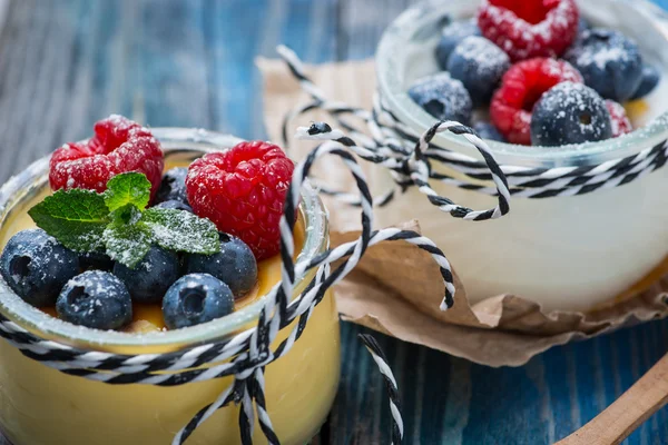 Fresh and healthy natural yogurt with berries on wooden table — Stock Photo, Image