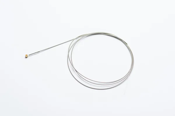 Guitar string on white surface — Stock Photo, Image