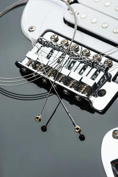 Electric guitar bridge with strings — Stock Photo, Image