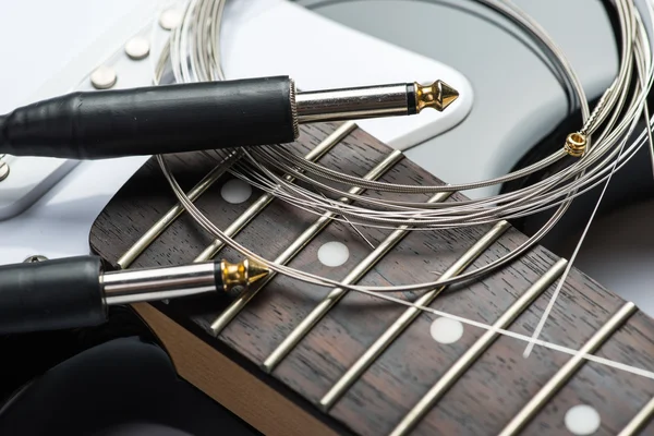 Guitar frets with strings, cable and jacks — Stock Photo, Image