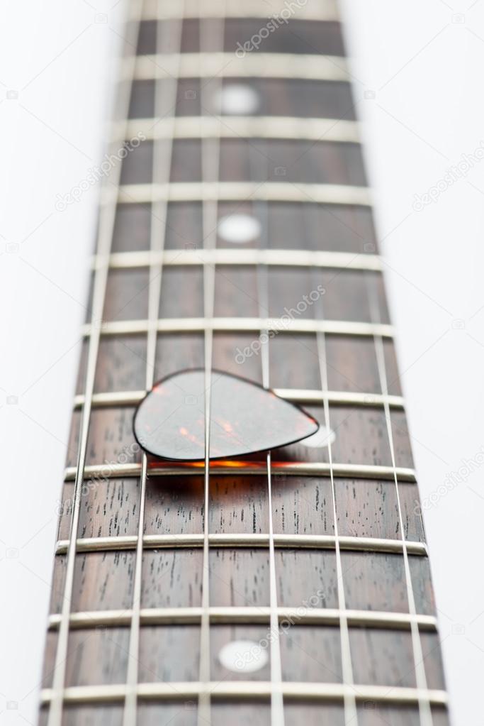 Guitar frets with strings and mediator