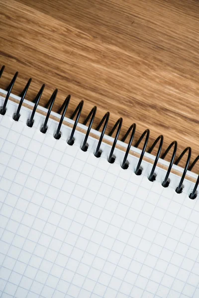 Notebook on a wooden table — Stock Photo, Image