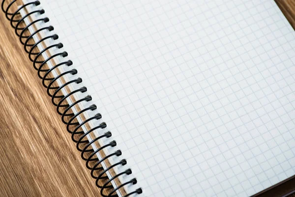 Notebook on a wooden table — Stock Photo, Image