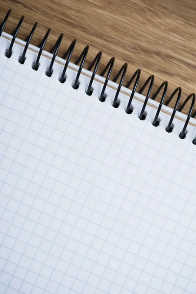 Notebook on a wooden table — Stock Photo, Image