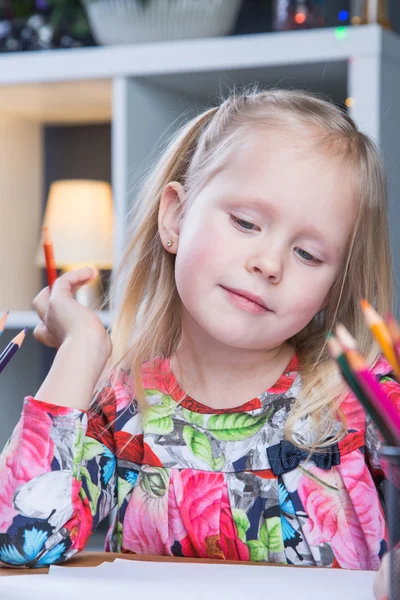 Small young girl drawing pictures with pencils — Stock Photo, Image