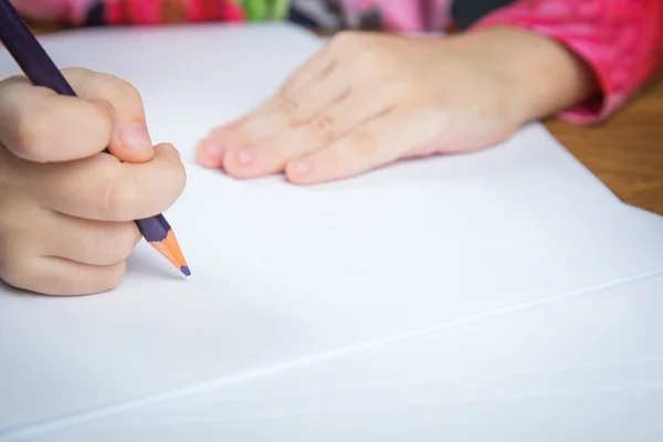 Small young girl drawing pictures with pencils — Stock Photo, Image