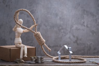 Hangman's noose, ev ve para ile oturan küçük ahşap kukla