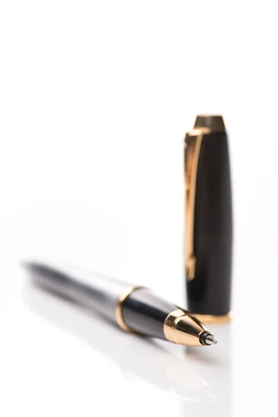 Black old fashioned pen on the white background, isolated. Royalty Free Stock Images