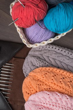 Handmade knitted hats with knitting accessories