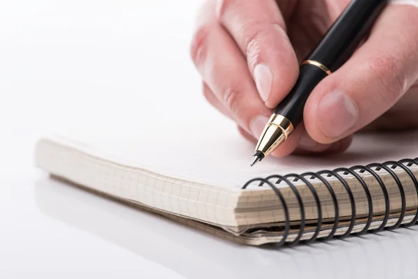 Man writing a note with black ball pen in his hand, isolated — Stock Photo, Image