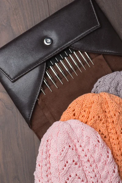 Handmade knitted hats with knitting accessories Stock Fotografie