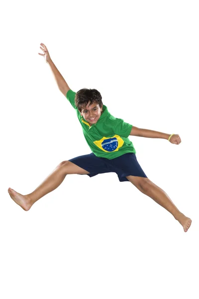 Brazilian Boy, jumping, yellow and blue — Stock Photo, Image