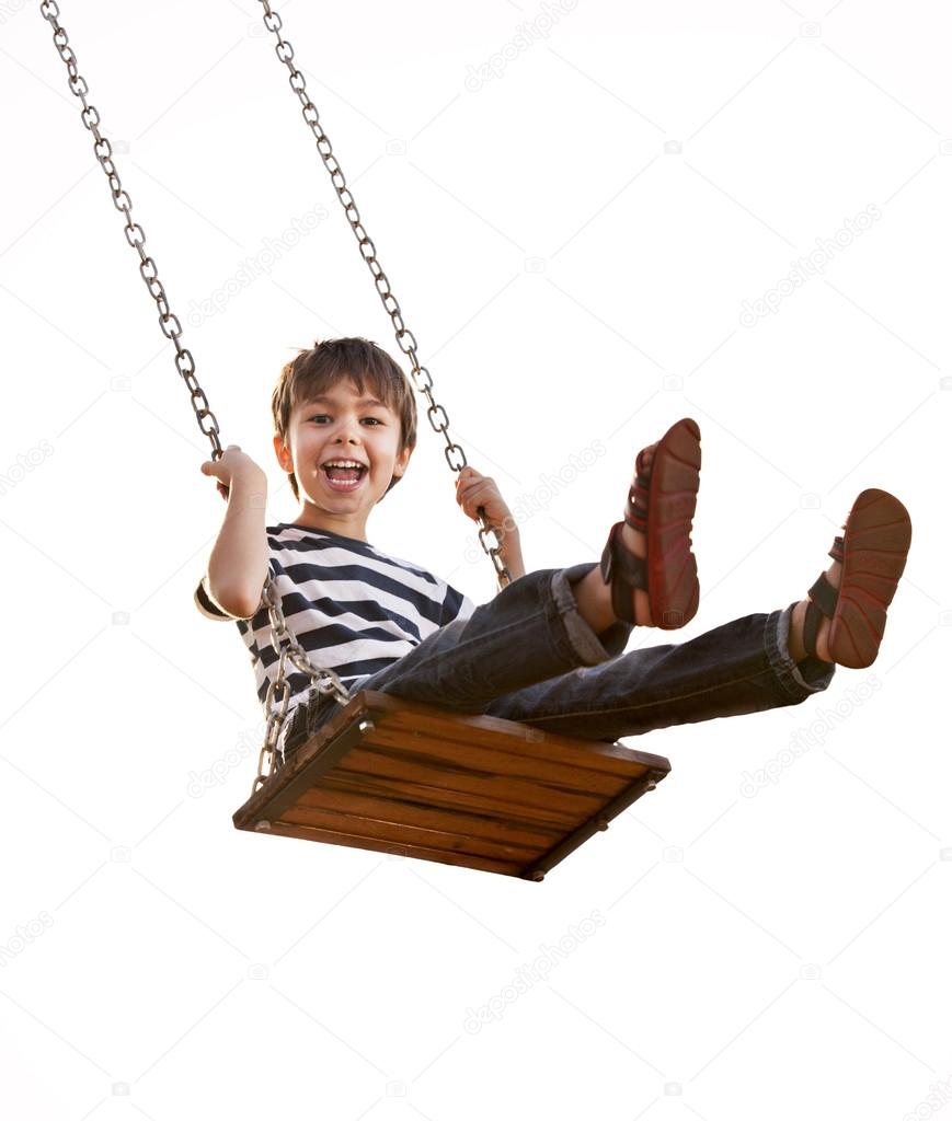 Cute boy playing on swing, having fun. On a white background.