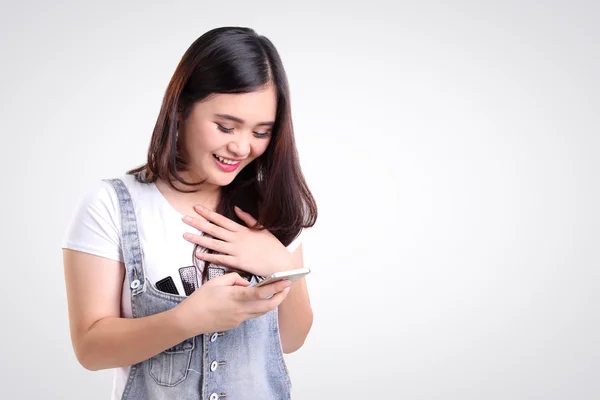 Girl checking phone with joy, isolated copy-space — Stock Photo, Image