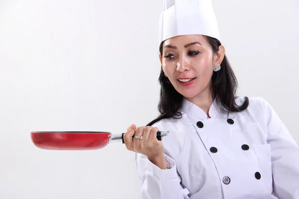 Kobieta kucharz i jej patelni — Zdjęcie stockowe