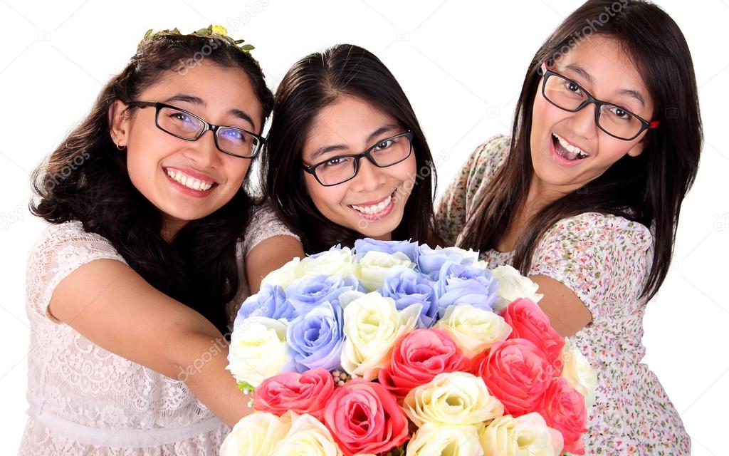 Young ladies giving roses bouquet isolated