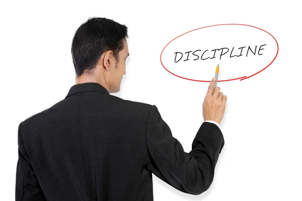 Geschäftsmann verweist auf "Disziplin"" — Stockfoto