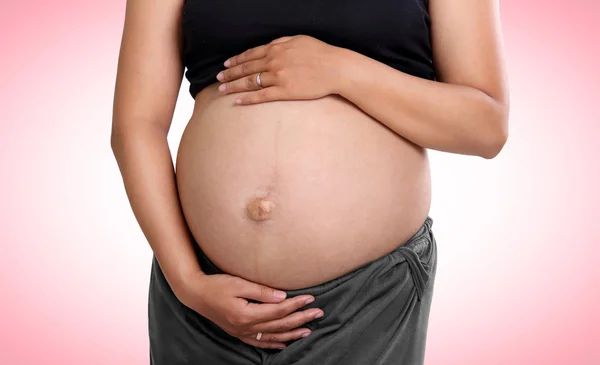 Pregnancy on pink — Stock Photo, Image