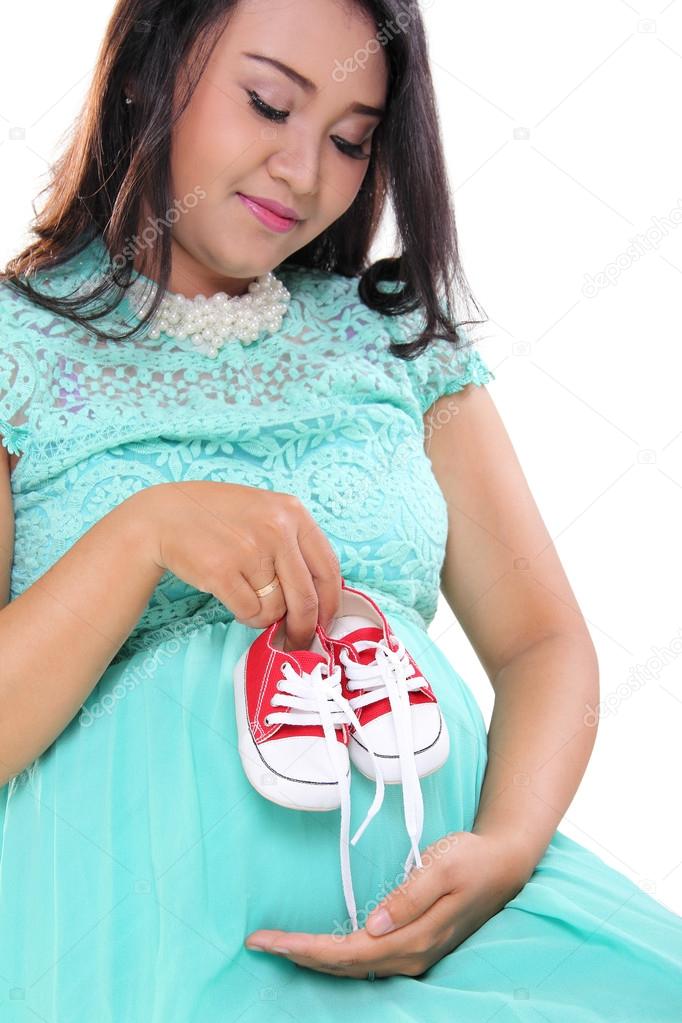 Expecting mother and baby shoes