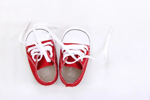 Small canvas shoes top view on white — Stock Photo, Image