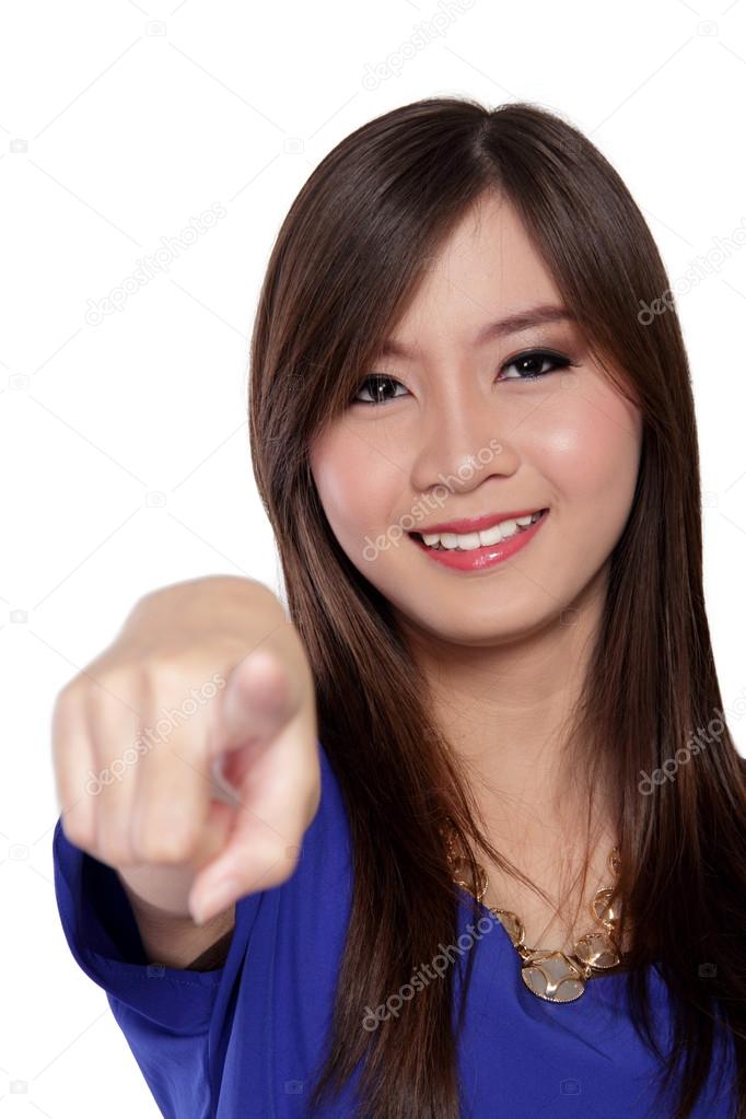 Happy young Asian woman with finger pointed to camera, isolated on white