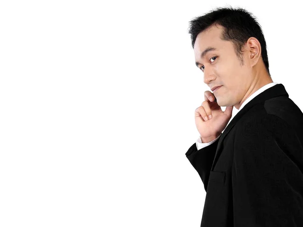 白で隔離、電話をかける若いアジア系のビジネスマンの側面図 — ストック写真
