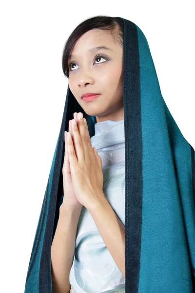 Catholic woman praying, isolated on white