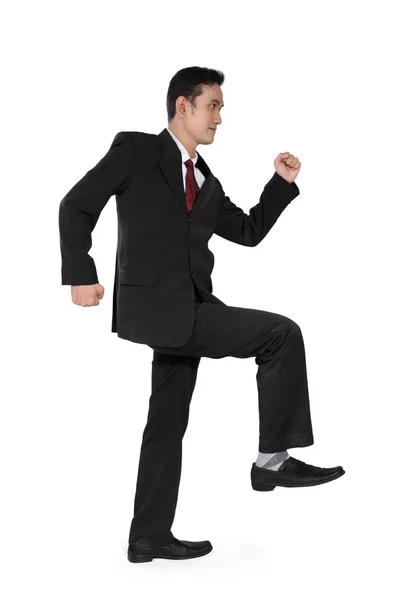 Businessman steps up — Stock Photo, Image