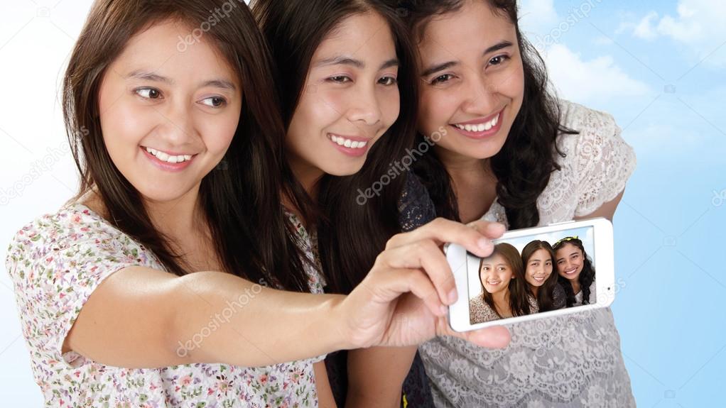 Beautiful Asian girls holiday selfie