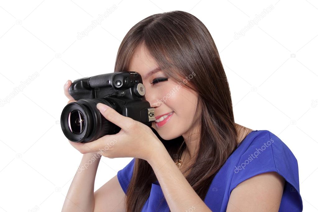 Asian girl take a picture with digital camera