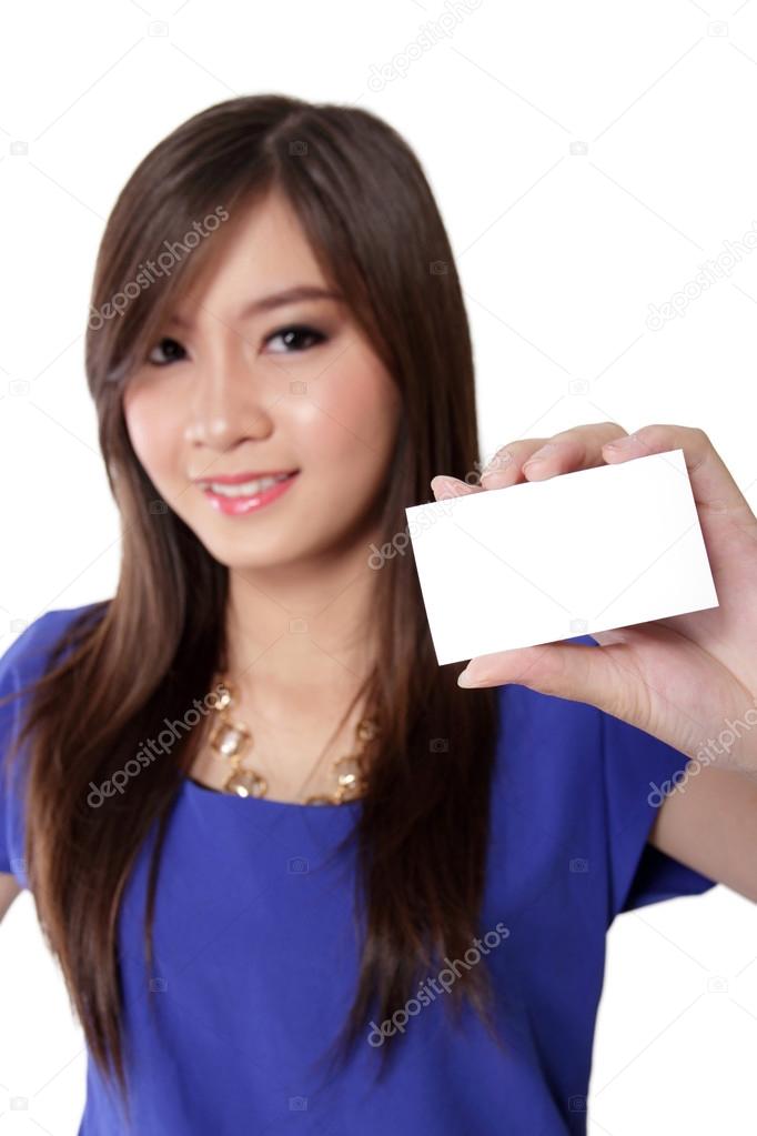 Nice woman holding white blank card. 