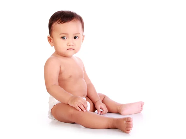 Baby sits sideways — Stock Photo, Image