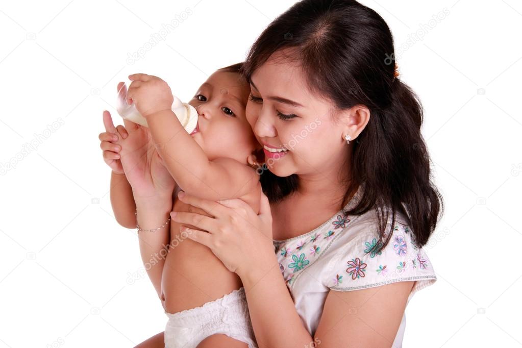 Caring mother feeding milk