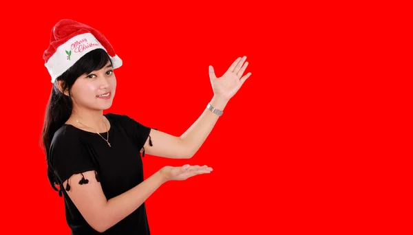 Christmas girl with side copyspace on red — Stock Photo, Image