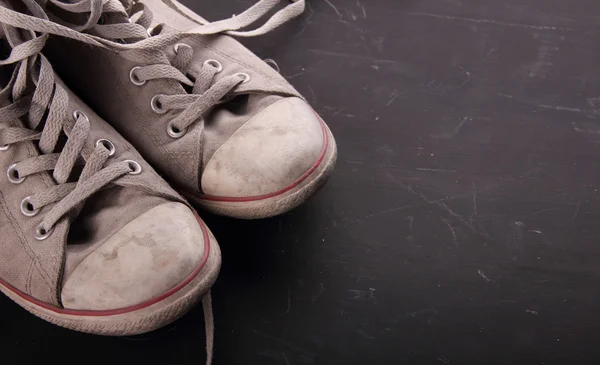 Dirty sneakers with copy space — Stock Photo, Image