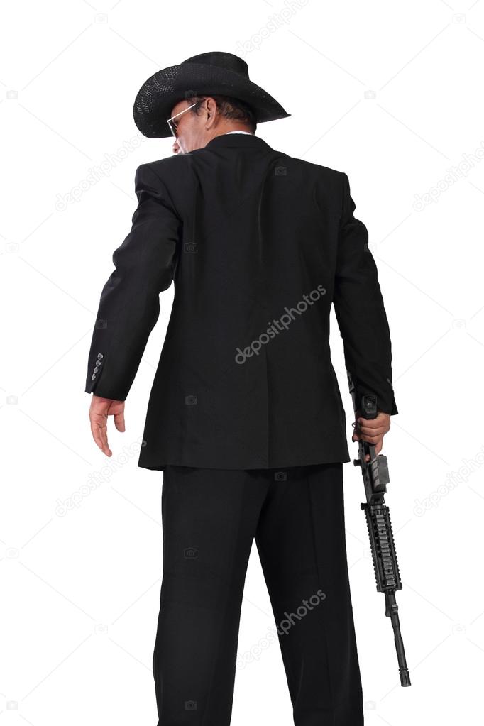 Hitman with a gun back-shot photo, isolated on white 