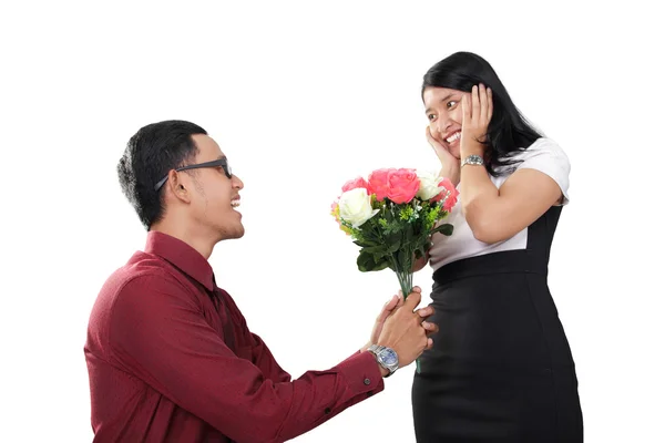 Man proposing with flowers, isolated on white — Stock Photo, Image