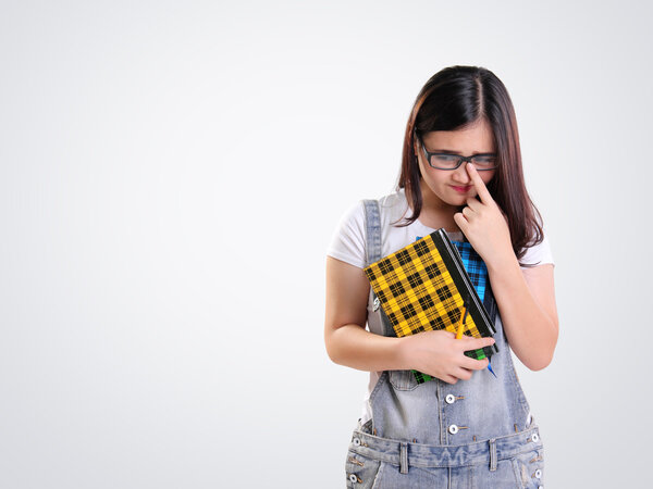 Awkward girl looking sideways on white