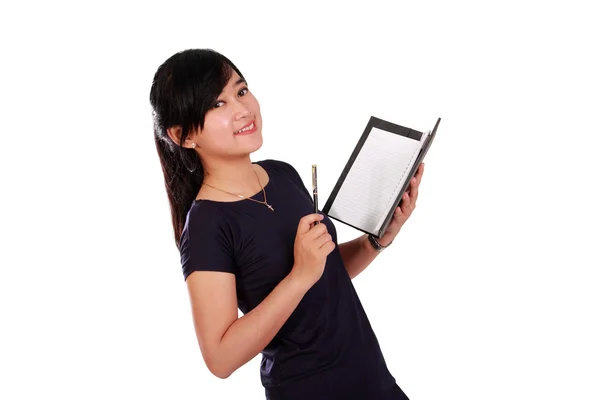 Smiling girl holding notebook isolated — Stock Photo, Image