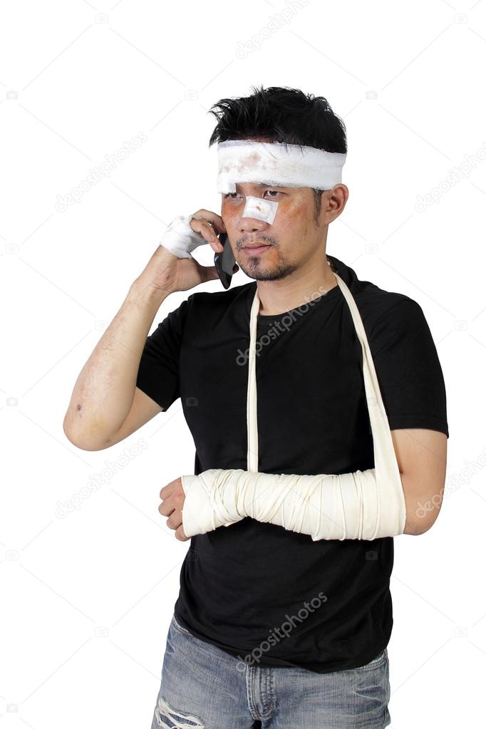 Bandaged man making phone call isolated