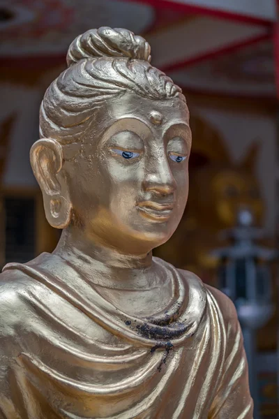 Buda'nın yüzünü kapatmak.