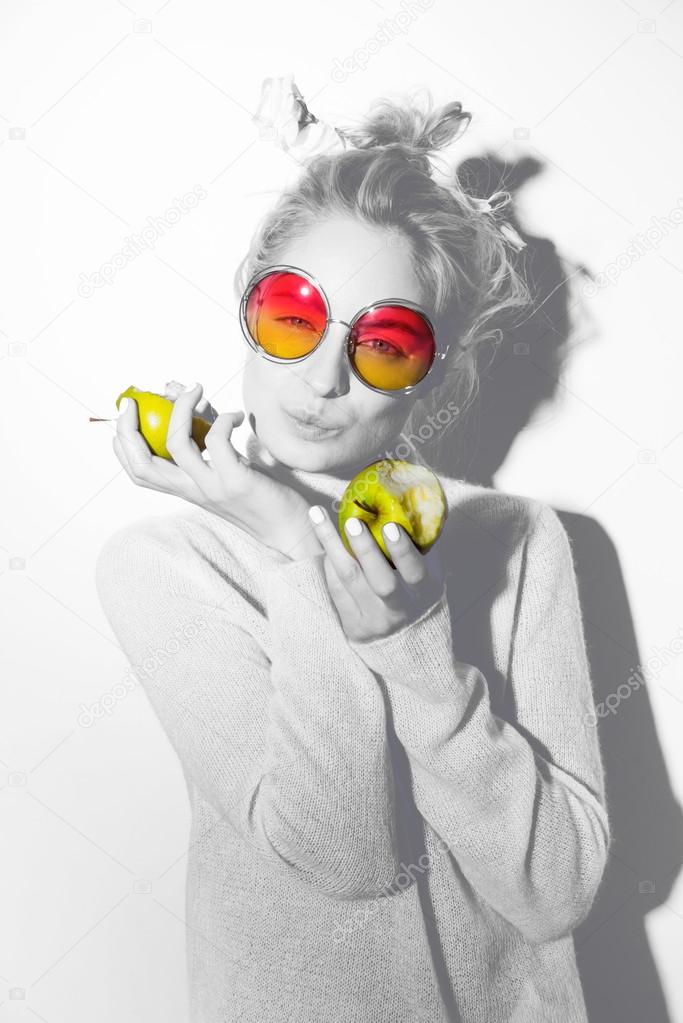 portrait of cheerful blonde hipster girl going crazy making funny face