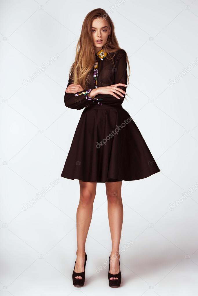 fashion model woman pose in studio on gray background