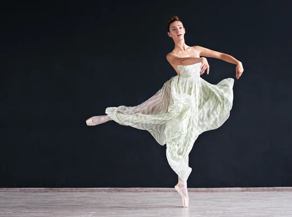 Portrait of the modern ballerina  in white dress on dark background — Stock Photo, Image